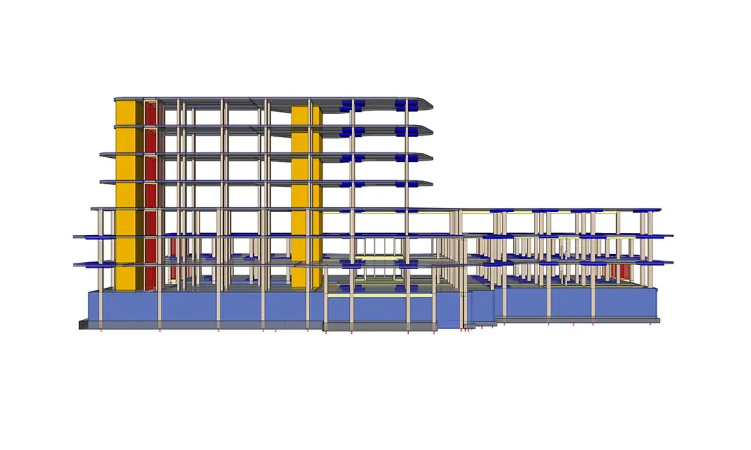 Vue en élévation d'un modèle BIM structurel à plusieurs niveaux montrant poteaux, poutres et voiles de noyau jaunes