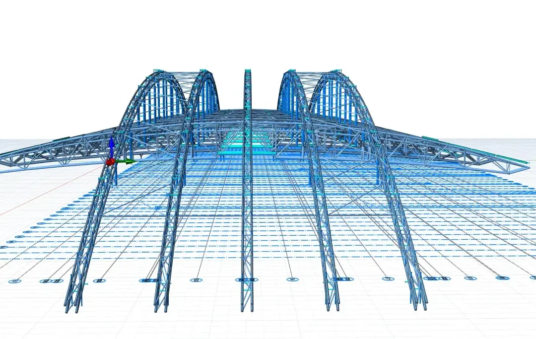 Vue frontale d'une structure de toiture de stade avec poteaux d'appui fuselés portant deux arcs métalliques jumeaux