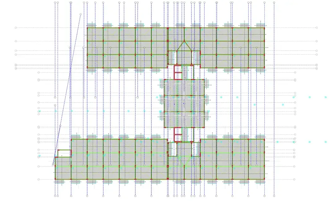 Plan de structure d'un complexe résidentiel montrant trois ailes reliées et leur trame de poteaux