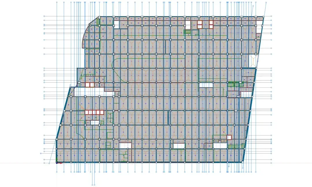 Plan de structure d'un niveau commercial avec une trame de poteaux régulière sur une emprise en biais