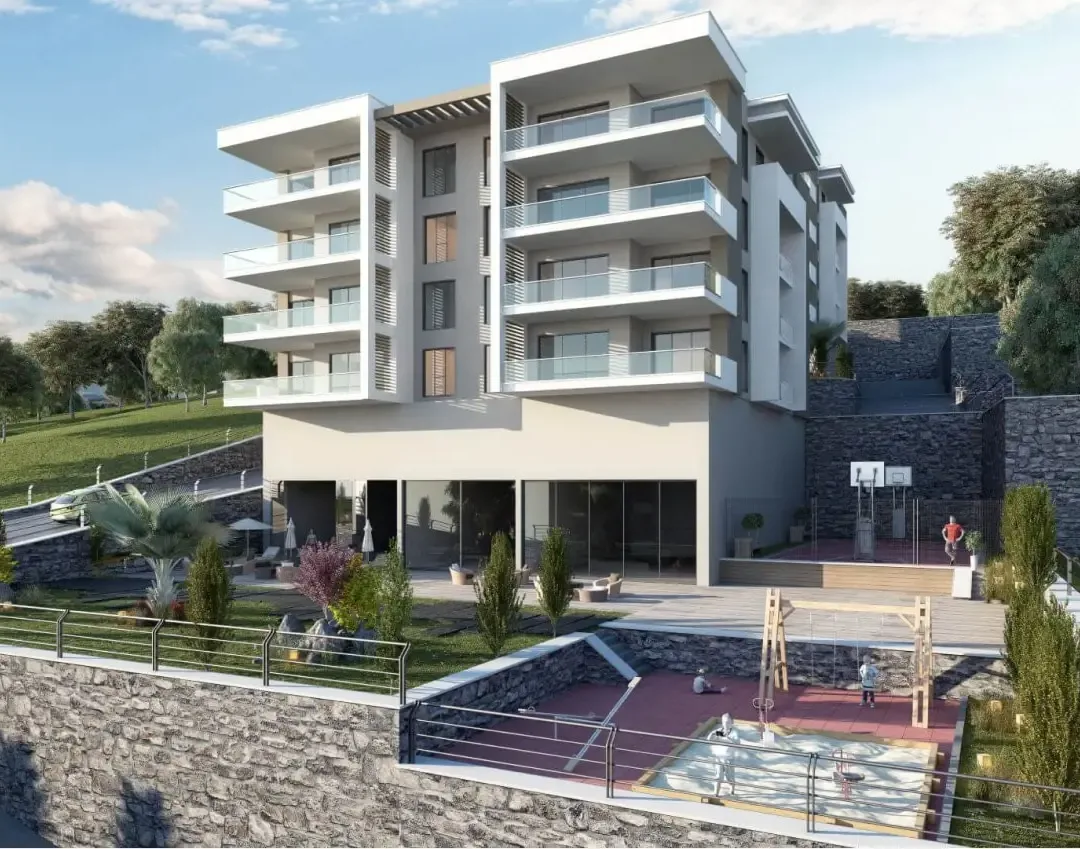 Rendu architectural d'un bloc résidentiel à flanc de colline avec balcons au-dessus d'une aire de jeux paysagère