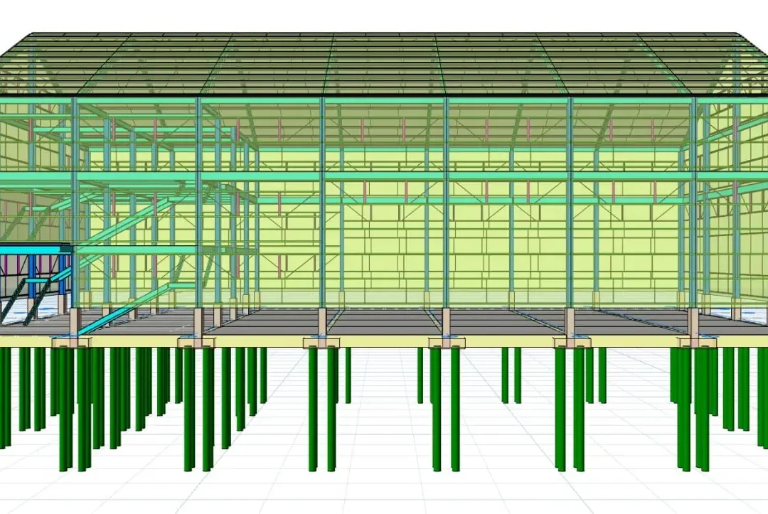 Kazık temel üzerindeki çerçeve açıklıklarını gösteren çelik laboratuvar binasının yan cephesi